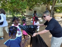 Sharon teaching kids about cleaning up area