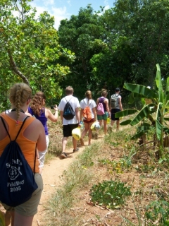 Walking through village of Lac'ajue to hand out gifts