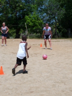 Meg & Sophia playing kickball with the boys