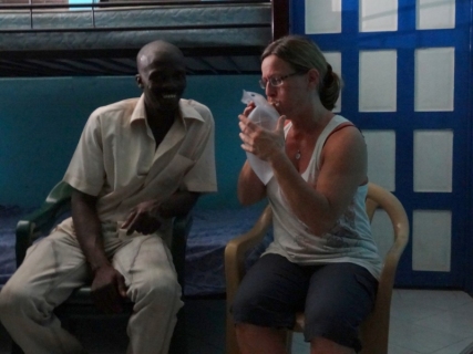 Pam shows Joseph the LuminAID solar lantern